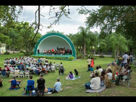Patrons enjoying live music by the Jamaica Defence Force Military Band at the Hope Royal Botanical Gardens’ Shell Bandstand.