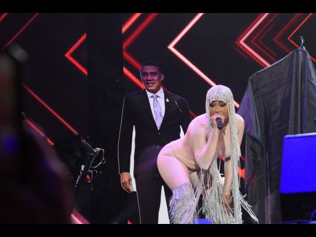 Ishawna dances on stage during Reggae Sumfest festival night one with a cardboard cut-out of Prime Minister Andrew Holness. 