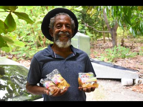 Credit: JIS Glover displays some of the products manufactured by his enterprise.