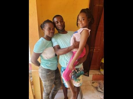 Eight-year-old Tamara Noble was left paralysed after the taxi in which she was travelling crashed in Trelawny five years ago. She is pictured here with her mother, Stacy-Ann Reeves Noble, and dad, Camar.