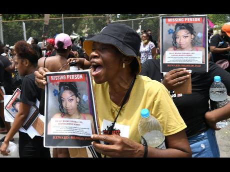 Dozens of demonstrators protest perceived police inaction in the investigation of the missing social-media influencer Donna-Lee Donaldson on Sunday. 