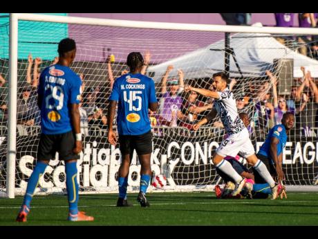 Alejandro Diaz (second right) of Pacific FC celebrates after a  goal during the Concacaf League match between Pacific FC and  Waterhouse FC at the Starlight Saprissa stadium in Victoria, Canada on Tuesday night. Pacific won 6-0. 