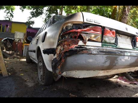 Credit: Ian Allen This car was partially damaged in the attack early Thursday.