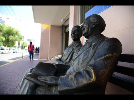 A statue of Sir Alexander Bustamante (right) and Norman Manley situated on Duke Street, downtown Kingston. 