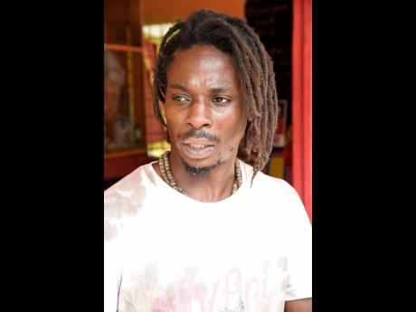 Credit: Ian Allen Fisherman Daniel Gayle ponders his next move after another chemical spill and fish kill.
