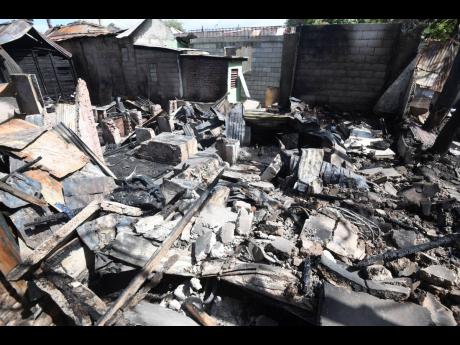 Credit: Ricardo Makyn Some of the damage caused by the fire which residents said was caused by arsonists who also fired at them.