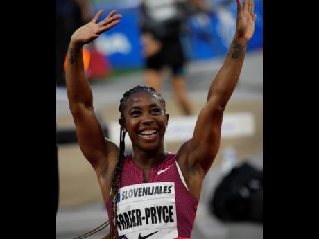 Shelly-Ann Fraser-Pryce of Jamaica celebrates after wining women's 100 metres at the Diamond League athletics meeting at the Louis II stadium in Monaco on Wednesday.