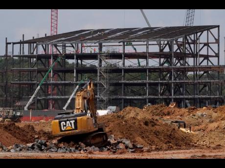 A file photo of construction personnel working on the Carolina Panthers’ practice facility on August 24 last year, in Rock Hill, South Carolina.