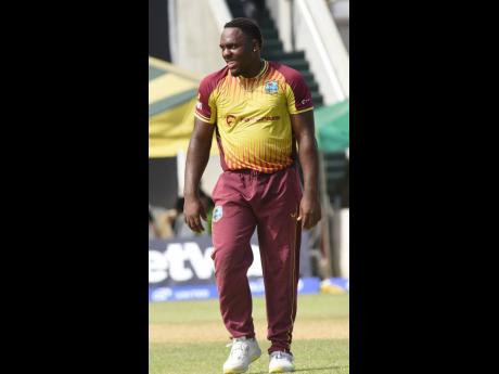 Left: Odean Smith captured four wickets for West Indies against New Zealand on Sunday.
