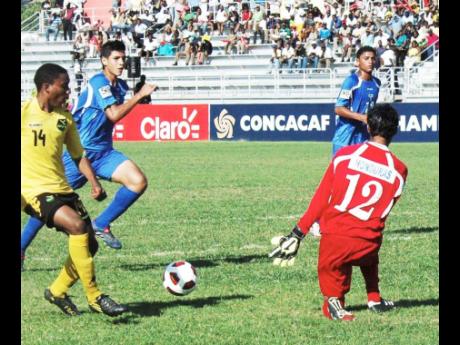 Jevani Brown (left) in action for Jamaica against Honduras during Concacaf qualifiers for the 2011 FIFA Under-17 World Cup in Montego Bay.  Jamaica won the match 2-1 to qualify for the Under-17  World Cup in Mexico.