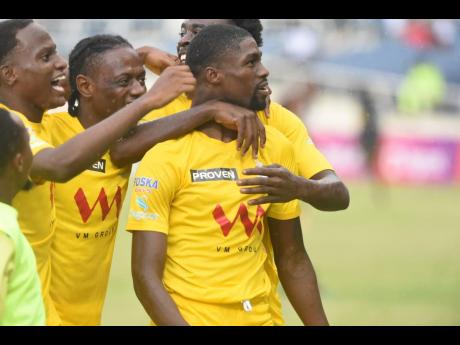 Members of the Harbour View team celebrate after scoring the opening goal against Dunbeholden during  Jamaica Premier League final at Sabina Park last season.