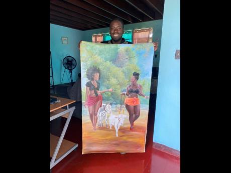 Oneil Clarke showing off one of his pieces.