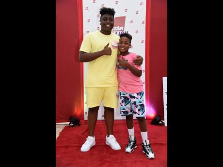 Credit: Nicholas Nunes/Photographer Marco Dean Davis (left) and Egypt-Knight Gordon give their thumbs up to THE STAR.