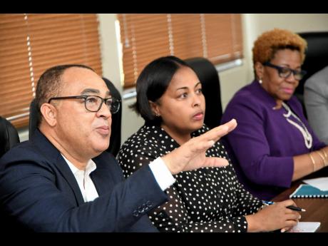 Tufton, Minister of Health and Wellness Dr Christopher Tufton speaks during the joint press briefing on substance use in secondary schools at the ministry’s headquarters in New Kingston yesterday. Looking on are Uki Atkinson (centre) research analyst at the National Council on Drug Abuse and Maureen Dwyer, acting permanent secretary, in the education ministry.