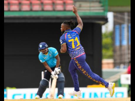 Kyle Mayers (right) of Barbados Royals celebrates the dismissal of Johnson Charles of Saint Lucia Kings during their Caribbean Premier League (CPL) match at Warner Park Sporting Complex yesterday in Basseterre, Saint Kitts and Nevis. Royals won the match by 11 runs.