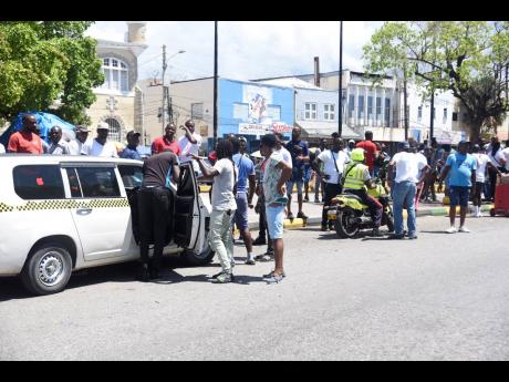 Taxi operators who terminate in the downtown Kingston area yesterday withdrew their service to press their claim for a traffic ticket amnesty.