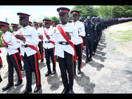 Credit: Rudolph Brown Newly minted cops march during yesterday’s passing-out parade for more than 300 constables at the police academy in Twickenham Park, St Catherine.