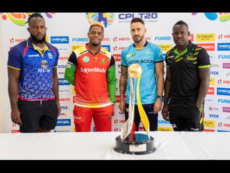Caribbean Premier League’s final four captains (from left)  Kyle Mayers of the Barbados Royals’, Shimron Hetmyer of the Guyana Amazon Warriors, Faf Du Plessis of the St Lucia Kings and Rovman Powell of the Jamaica Tallawahs pose with the trophy during yesterday’s play-off press conference in Guyana.