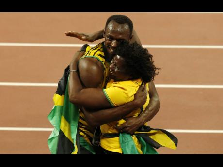 Usain Bolt celebrates with his mother Jennifer Bolt after winning the gold medal in the men’s 100 metres final during the World Athletics Championships at the Bird’s Nest stadium in Beijing in 2015.