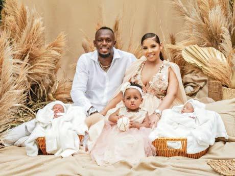 Usain Bolt with partner Kasi Bennett and Olympia (front centre) after the birth of twin boys Saint Leo Bolt and Thunder Bolt in June last year.