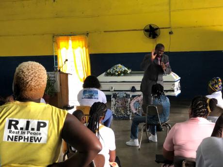 Pastor Dexter DeCordova delivers the sermon at the funeral of Trench Town teen Nevardo Mateland.
