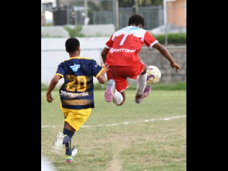 Campion College’s Kai Myles (right) controls a pass ahead of Antwan Patterson of Cumberland High during an ISSA/Digicel Manning Cup match at Campion College on Wednesday, October 12, 2022 