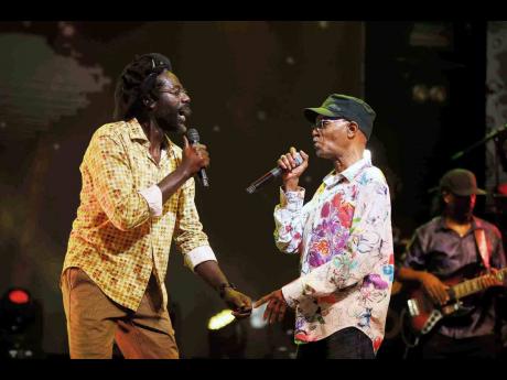 Beres Hammond (right) and long-time friend Buju Banton in performance.
