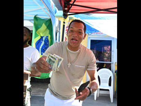 Credit: Gladstone Taylor Self-described France ‘wagonist’ Richard Douglas jeers patrons to wager on the England v Senegal game.