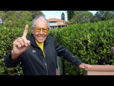 Tennis coach Nick Bollettieri gestures outside his home in January 2021, in Bradenton, Florida. Nick Bollettieri, the Hall of Fame tennis coach who worked with some of the sport’s biggest stars, and founded an academy that revolutionised the development of young athletes, has died. He was 91. Bollettieri passed away Sunday.