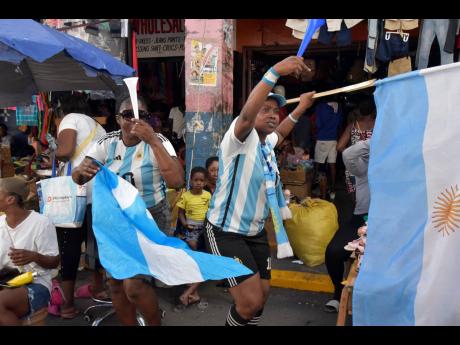 Argentina supporters Vanessa Morgan (left) and Kadeen ‘Guzzu Boss’ Richards make a joyful noise as their team progressed.