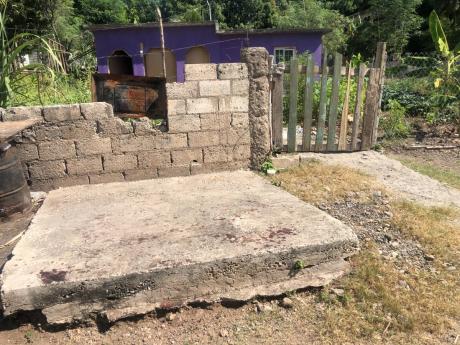 A bloodstained area near the house in Vershon Gully, Nine Miles, Bull Bay, St Andrew, where Sonia Campbell was chopped to death on Friday night.