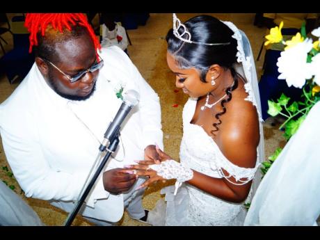 Credit: Contributed Big Pop and wife Jamila exchange rings at their wedding.