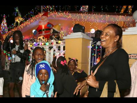 Charmaine McLeod (right) of Swaby’s Hope in Manchester shared that when she saw the Christmas lights, she couldn’t keep it to herself. So she gathered 10 children from the Ebenezer United Church and brought them to see it for themselves.
