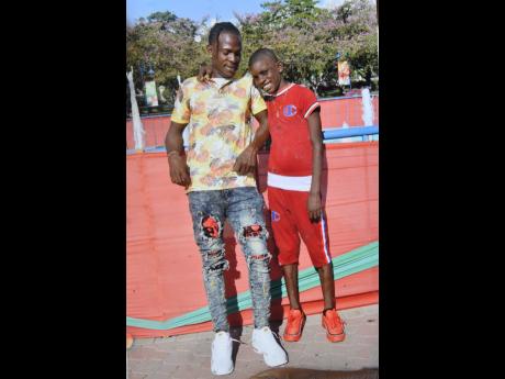 Credit: Rudolph Brown Picture shows a photo of Dwayne Edwards and his son Joshua.