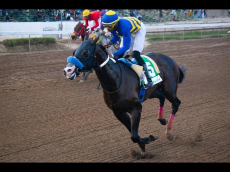 I’VE GOT MAGIC, ridden by Tevin Foster, wins the St Catherine Cup over six furlongs, a three- year-old and upwards open allowance stakes at Caymanas Park recently.