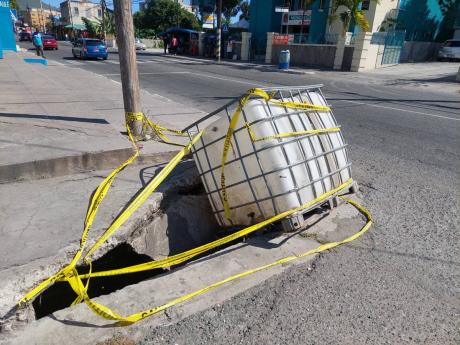 This hole in the sidewalk along Windward Road, Kingston, presents a major risk to pedestrians, including members of the disabled community. 