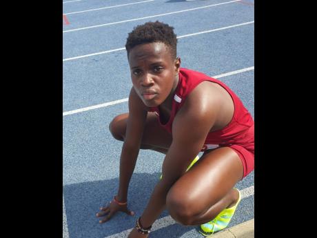 Holmwood captain Rickiann Russell recovers after her personal best 52.88 seconds in the Class I girls’ 400 metres at the Queen’s/Grace Jackson Invitational on Saturday at the National Stadium.