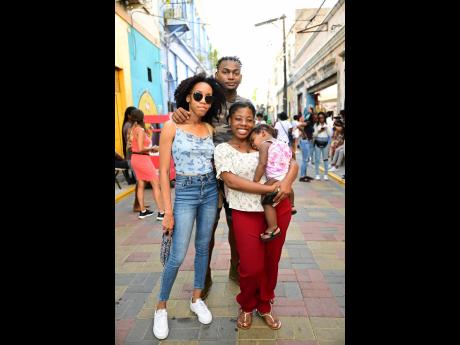 The quartet of (from left) Jodian Campbell, Shaquil Bagaloo, Carrie Perrier and her daughter Ziyah were among the scores of persons who enjoyed the sights, sounds and entertainment at the ArtWalk.