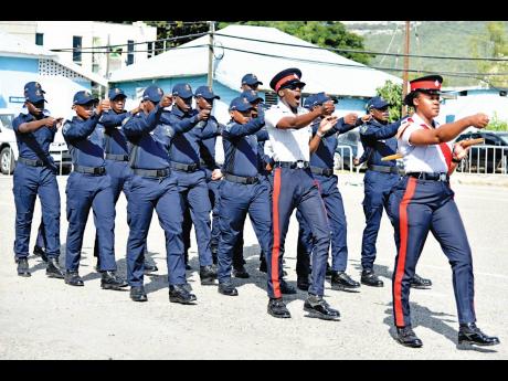 Jamaica Constabulary Force cadets march during a small handover ceremony of ICT equipment. The ceremony took place at Harman Barracks in Kingston.