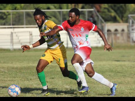 Credit: Lennox Aldred Vere United’s goalscorer Lamard Neil (left) gets by Harbour View’s Demar Rose during their Jamaica Premier League encounter at the Wembley Centre of Excellence yesterday. Vere United won 1-0.