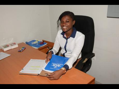Recipient of the most outstanding performance in humanities award in the 2022 sitting of the Caribbean Examinations Council’s Caribbean Advanced Proficiency Examination, Dora Watt, at work at the Montego Bay Restorative Justice Centre in St James. 