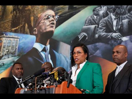 Ilyasah Shabazz (second right), daughter of Malcolm X, speaks during a news conference at the Malcolm X and Dr Betty Shabazz Memorial and Educational Center in New York, on Tuesday. Some of Malcolm X’s family members and their attorneys announced their intent to sue governmental agencies for Malcolm X’s assassination and the fraudulent concealment of evidence surrounding the murder. In 1965, minister and civil rights activist Malcolm X, 39, was shot to death inside Harlem’s Audubon Ballroom in New York. 