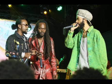 Popcaan (left), Jesse Royal (centre) and Protoje share the stage at Lost In Time Festival, held at Hope Gardens on Saturday.