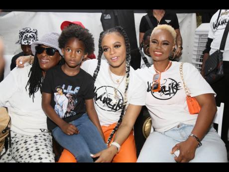 Lila Iké (second right) chills with (from left) grandmother Millicent Johnson; niece Shahida Morrison; and mother Paulette Holness, following her performance at Lost In Time Festival on Saturday.