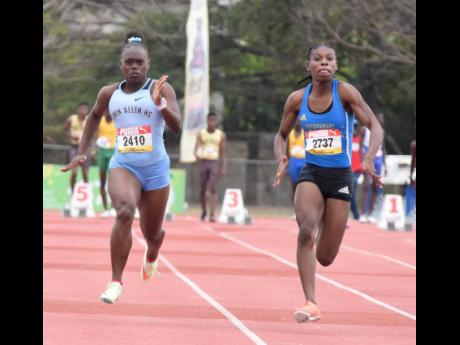 Credit: Ian Allen Hydel’s Alana Reid (right) powers away from Edwin Allen’s Serena Cole to win the Class I girls’ 100 metres title at the Central Athletics Championships at G.C. Foster College on Wednesday. Reid clocked 11.39 seconds, with Cole doing 11.93.