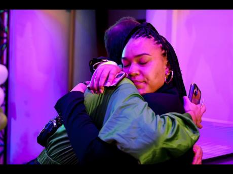 Jacob Lavicky and Sakinah B Smith hug after campaign director Ryan Kiesel conceded at the vote Yes on State Question 820 watch party at the Tower Theatre in Oklahoma City, on Tuesday. Oklahoma voters rejected the legalisation of recreational marijuana. 