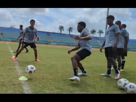 Trinidad and Tobago’s footballers train at Manny Ramjohn Stadium in Marabella on Monday as they prepare for their two-game friendly international against Jamaica on Saturday and Tuesday.