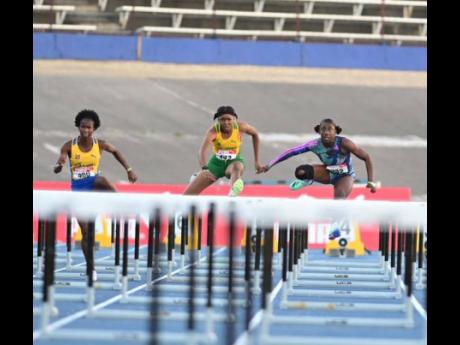 Credit: File St Elizabeth Technical High’s Habiba Harris (left) on her way to victory in the Under-20 girls’ 100 metres hurdles final at the Carifta Trials on Sunday at the National Stadium. Harris won in 13.35 seconds defeating Petersfield High’s Alexis James (right) who placed second in 13.38.