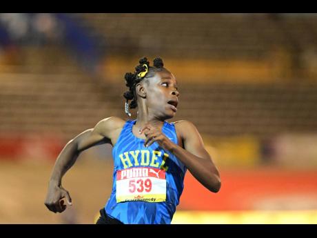 Hydel’s Alana Reid reacts after crossing the finish line in the Class One girls’ 100 metres final at the ISSA/GraceKennedy Boys and Girls’ Athletics Championships at the National Stadium. Reid won with a record-breaking time of 10.92 seconds.