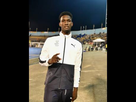 Jamaica College’s (JC) Uroy Ryan enjoys his victory in the Class One boys’ long jump at the ISSA/GraceKennedy Boys and Girls’ Athletics Championships at the National Stadium last night.